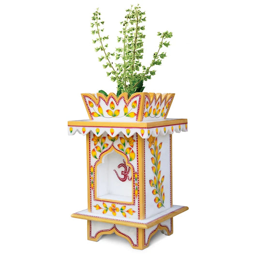 Close-up of traditional hand-painted artwork and floral motifs on marble Tulsi pot