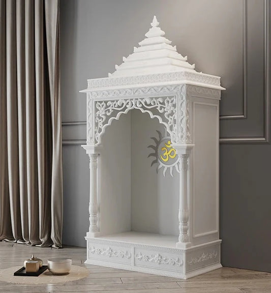 Close-up of Surya carving and pillars on marble pooja mandir