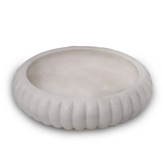Side profile and smooth finish detail of traditional white marble Urli