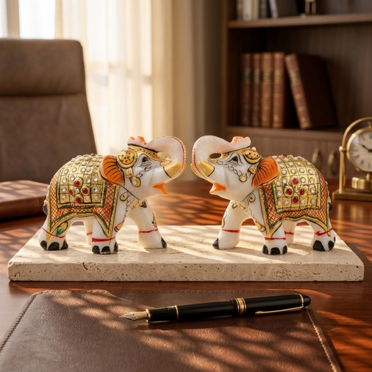 The Royal Ambabari Pair: Hand-Carved Natural White Marble Elephants with Ornate Gold Foil Jhool & Studded Kundan Detailing (Pair of 2)ndcrafted Marble Elephant Pair – Decorative Figurines with Stone & Gold Work