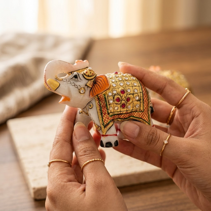 The Royal Ambabari Pair: Hand-Carved Natural White Marble Elephants with Ornate Gold Foil Jhool & Studded Kundan Detailing (Pair of 2)ndcrafted Marble Elephant Pair – Decorative Figurines with Stone & Gold Work