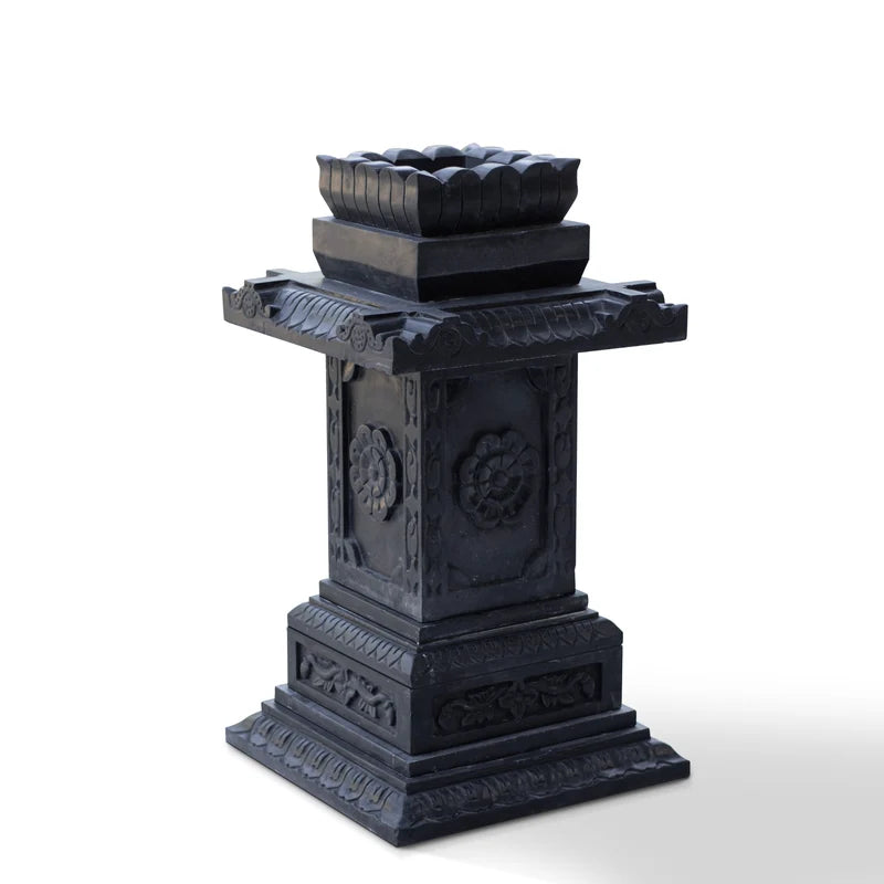 Carved black marble Tulsi pot placed for balcony and courtyard decor