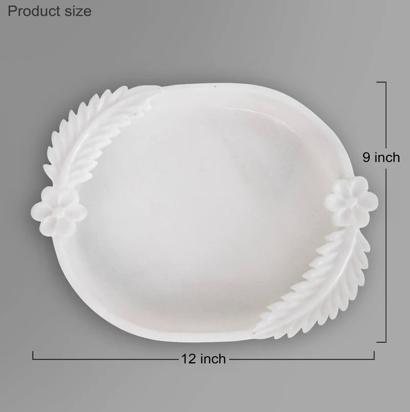 Double leafed white marble Urli bowl decorated with floating flowers and candles for home decor