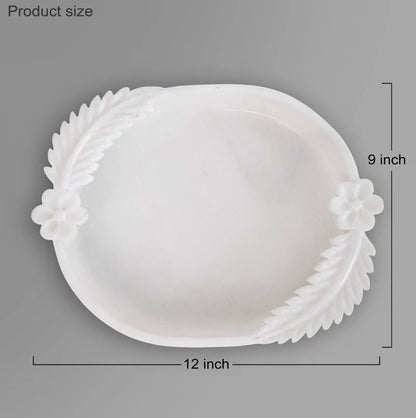 Double leafed white marble Urli bowl decorated with floating flowers and candles for home decor
