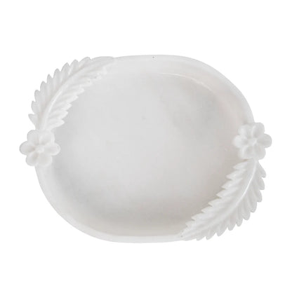 Double leafed white marble Urli bowl decorated with floating flowers and candles for home decor