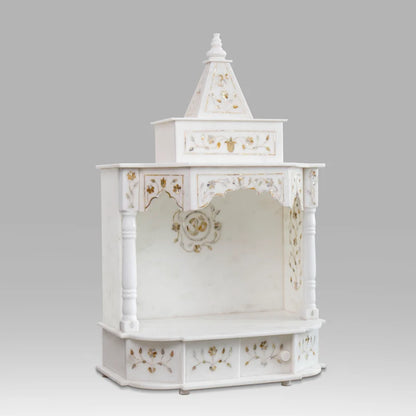 Royal handcrafted marble home temple with golden inlay set up for daily pooja in a modern living space