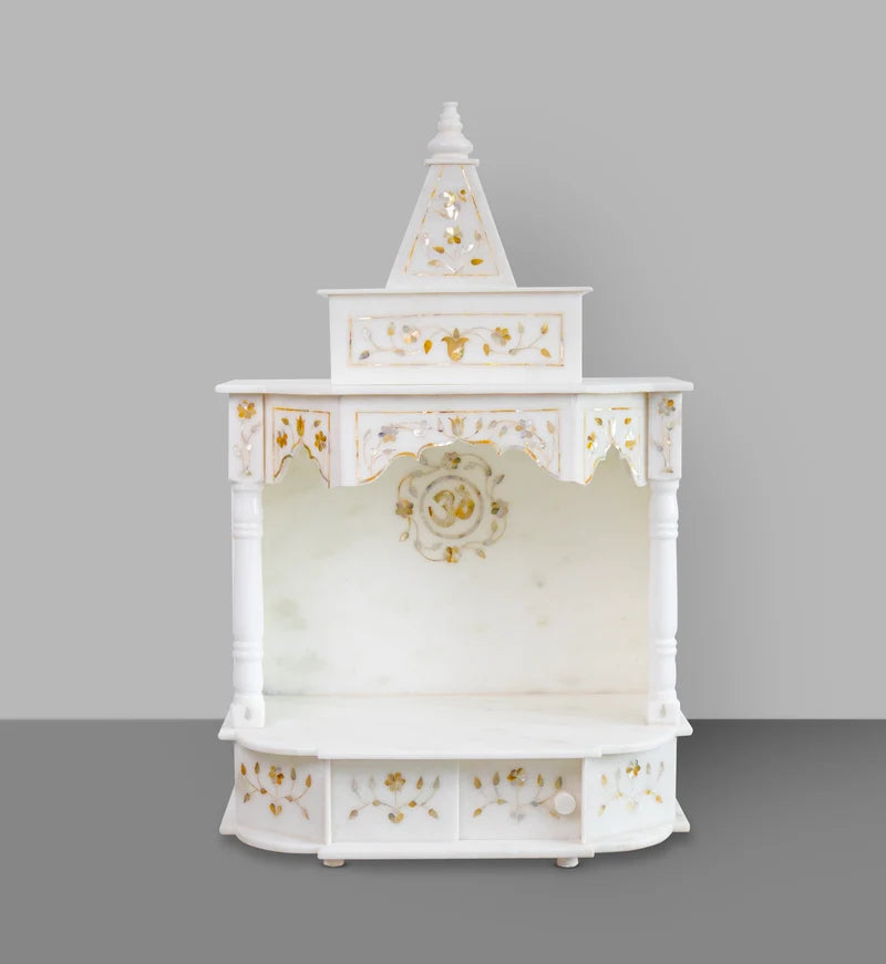 Intricate golden inlay stonework and traditional carvings on a premium royal home mandir