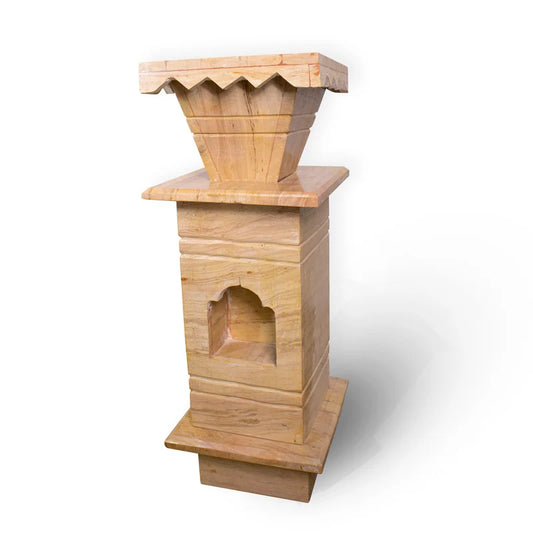 Side view and natural earthy stone texture detail of brown marble Tulsi pot