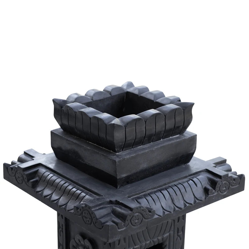 Carved black marble Tulsi pot placed for balcony and courtyard decor