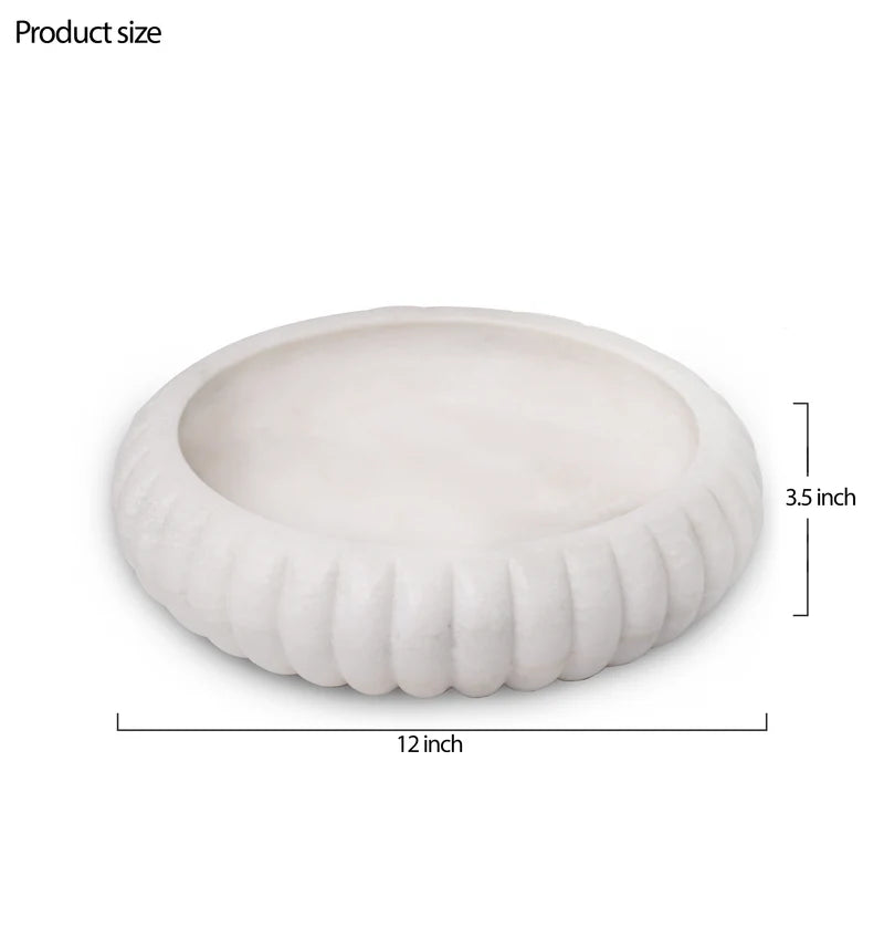 Classic white marble Urli bowl decorated with floating flowers and candles for home decor