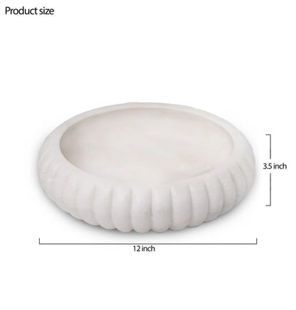 Classic white marble Urli bowl decorated with floating flowers and candles for home decor