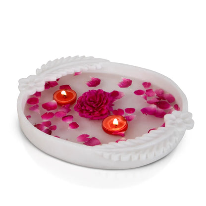 Double leafed white marble Urli bowl decorated with floating flowers and candles for home decor