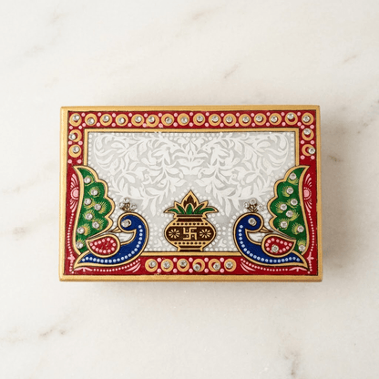 Intricate detailing on the Makrana marble Kamdhenu cow and traditional pooja diya