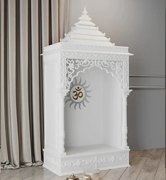 Close-up of Surya carving and pillars on marble pooja mandir