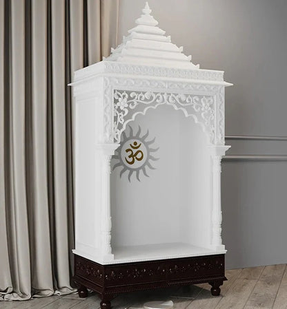 Close-up of Surya carving and pillars on marble pooja mandir