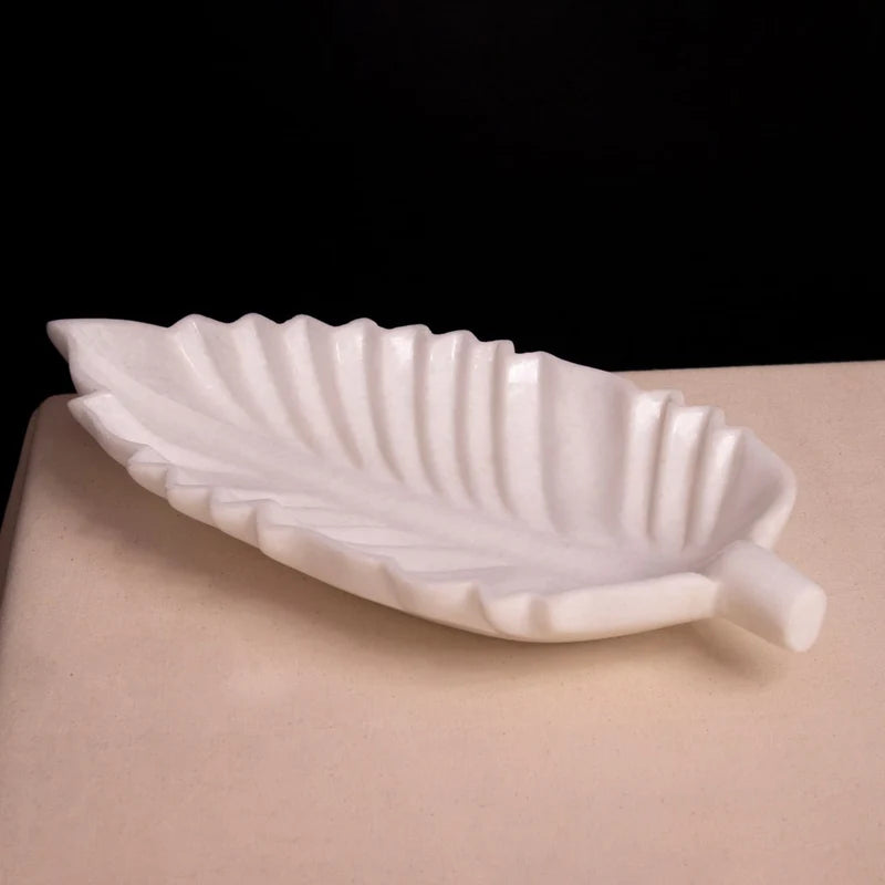 Front view of handcrafted leaf-shaped white marble Urli bowl by Rajasthani Duniyaa