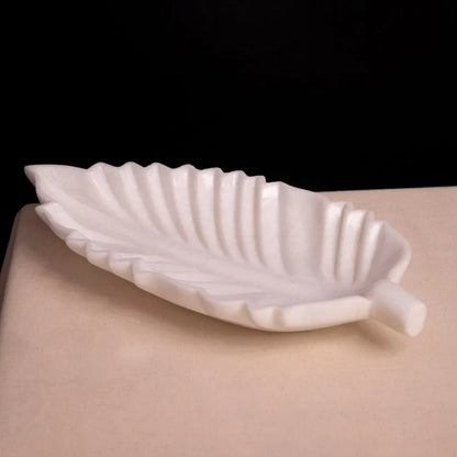 Front view of handcrafted leaf-shaped white marble Urli bowl by Rajasthani Duniyaa