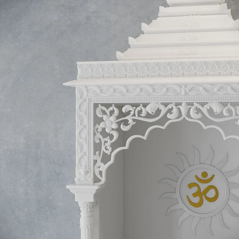 Inner sanctum view of traditional white marble temple with Surya design