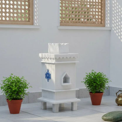 White marble Tulsi pot with 3 symbols placed for balcony and courtyard decor