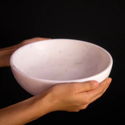 Side profile and depth detail of natural white marble Urli and fruit bowl