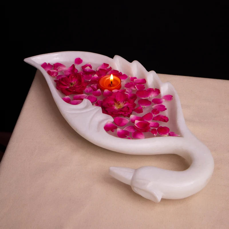 Peacock motif white marble Urli bowl decorated with floating flowers and candles for home decor