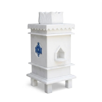White marble Tulsi pot with 3 symbols placed for balcony and courtyard decor