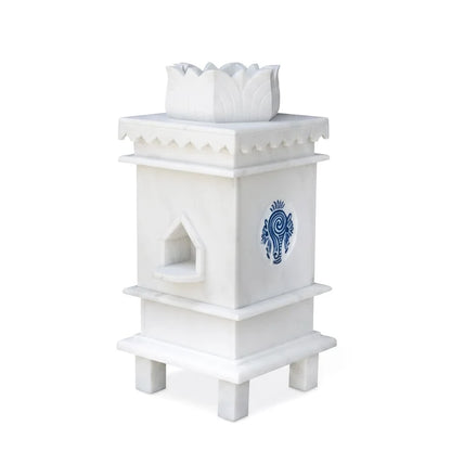 White marble Tulsi pot with 3 symbols placed for balcony and courtyard decor