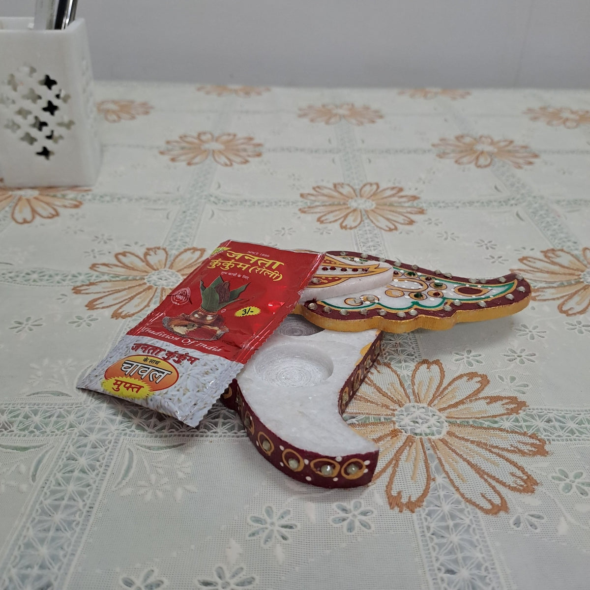 Handcrafted 5 inch white marble tilak chopda in Ganesha trunk shape for pooja kumkum and roli
