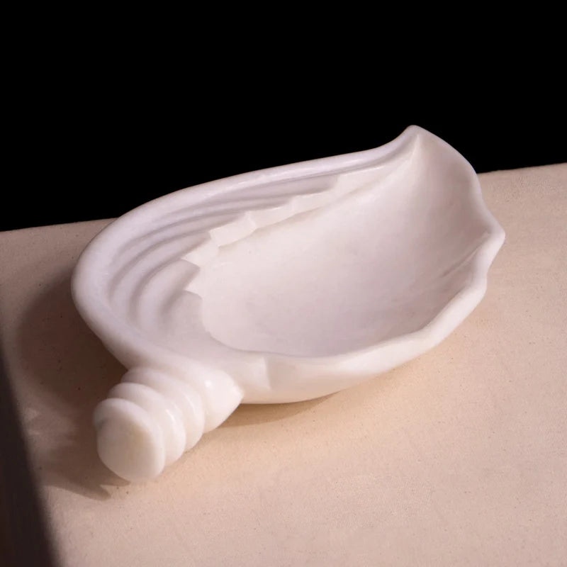 Front view of handcrafted shell-shaped white marble Urli bowl by Rajasthani Duniyaa