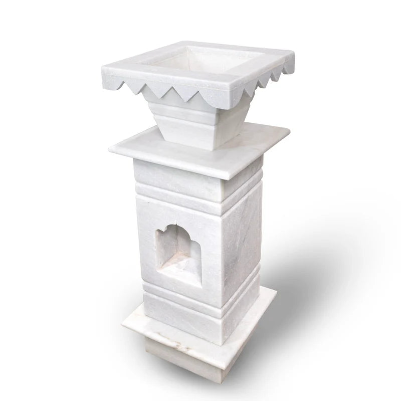 Side view and shape detail of traditional white marble Tulsi pot