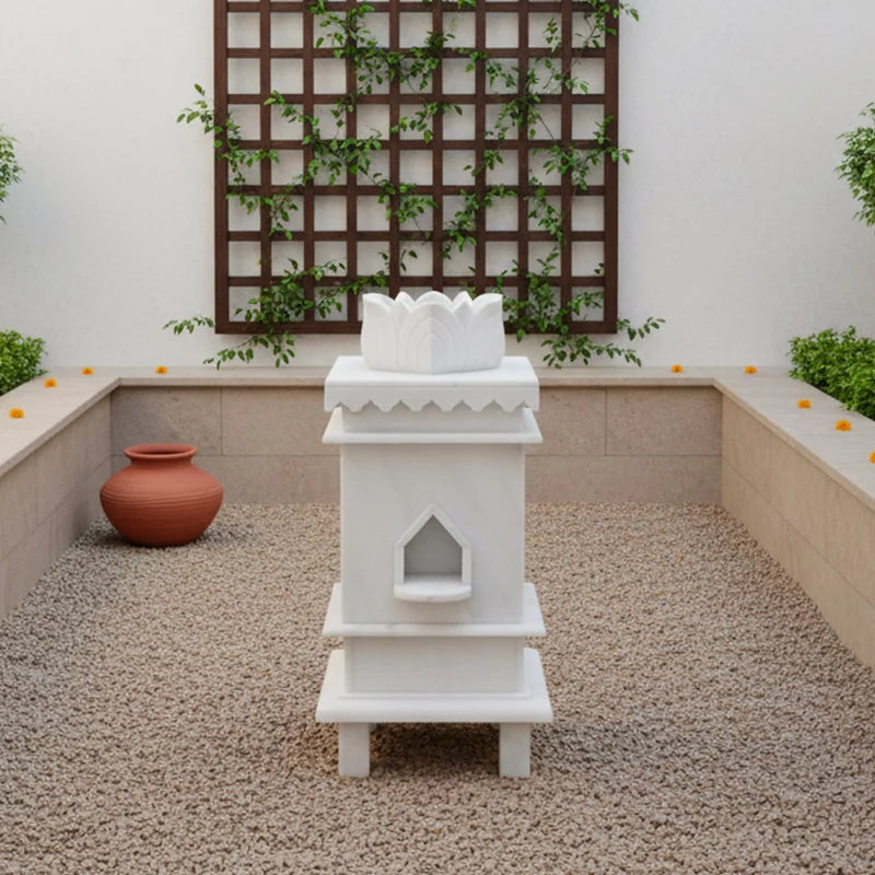 Close-up of sacred 3 symbols and traditional artwork on white marble Tulsi planter