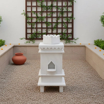 Close-up of sacred 3 symbols and traditional artwork on white marble Tulsi planter