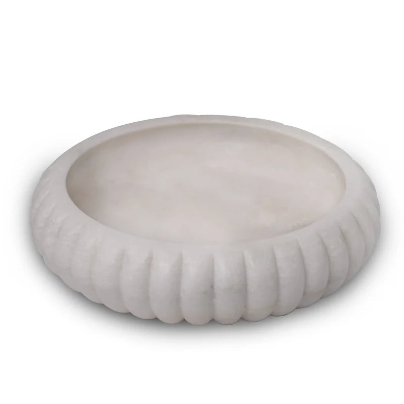 Side profile and smooth finish detail of traditional white marble Urli