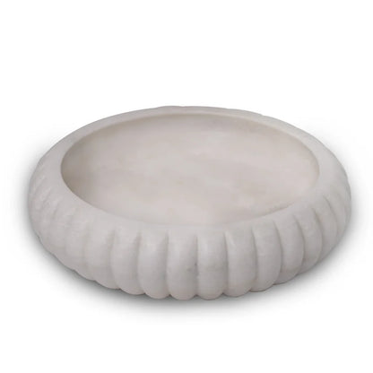 Side profile and smooth finish detail of traditional white marble Urli
